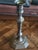 Vintage, octagonal-base brass candlestick, which shares stylistic characteristics with Georgian or Louis XIV period...