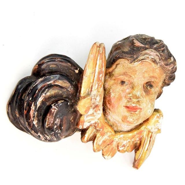 Angel, made in the 18th century. An exceptional pair of hand-carved angels with original polychromy. The figures are...