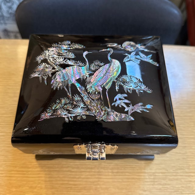 Design Plus Gallery presents a Jewelry Box with Mother of Pearl Inlays. The box on the outside is resplendent with shiny...