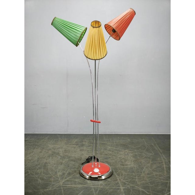 An exceptionally rare german mid-century modern floor lamp manufactured during the 1960s. This sculptural three-light...