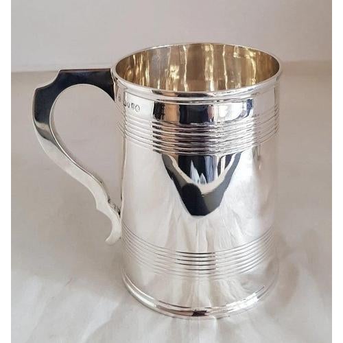 A fine victorian english sterling silver mug or tankard by h. J. Lias & son, hallmarked in london for 1877. Crafted in...