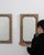 A pair of circa 1900 French wall mirrors crafted in oak, featuring a more compact format with a straightforward frame...
