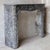 This impressive antique Dutch marble fireplace in the "Trois Coquilles" model is crafted from St. Anne marble. The front...