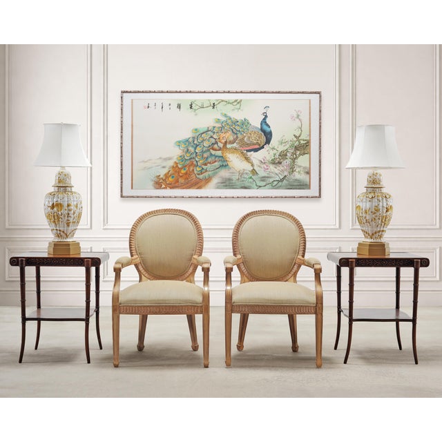 A beautifully rendered Chinese Export 20th century painting depicting a pair of peacocks amid an ancient tree with...