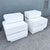 A striking pair of postmodern waterfall nightstands, defined by their sculptural, space-age form and high-gloss white...