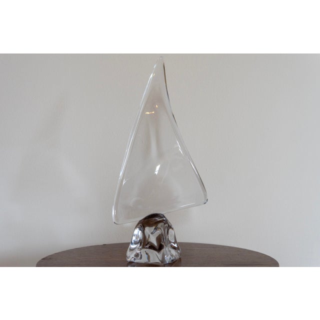 A striking sailboat sculpture by Daum, the renowned French crystal house celebrated for its mastery of pâte de verre and...