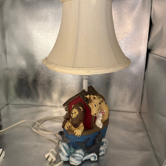 Made in 1993 the animals were hand sculpted by resin. The entire lamp is hand painted. It’s made in China.