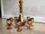 Murano Ruby red glass decanter and 8 glass cups featuring 24k gold gilt and hand painted white enamel flowers. I bought...