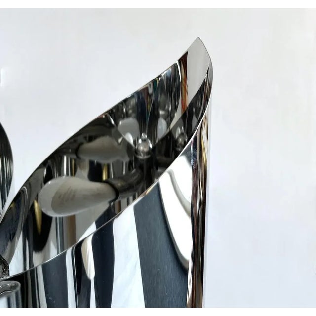 Earth sculpture lamp entirely made of steel, equipped with three fires. attributable to the Uginox production on a design...