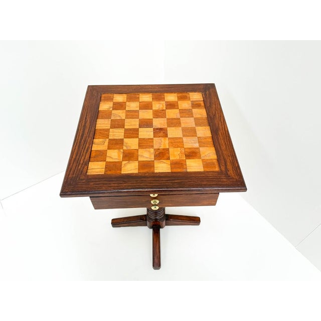 This vintage wooden chess table features a beautifully crafted checkered playing surface embedded in a rich, dark-stained...
