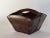 Antique wooden rice bucket with metal reinforced corners, tapered square shape and handle across the middle. This rustic...