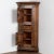 This is an early nineteenth century antique pine corner cabinet, circa 1800. It has two paneled cabinet doors and a middle...