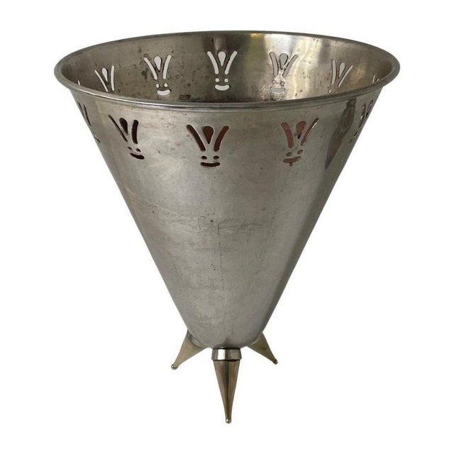 Champagne cooler or ice bucket with some definite age to it. Online research has us accrediting the design to Phillipe...