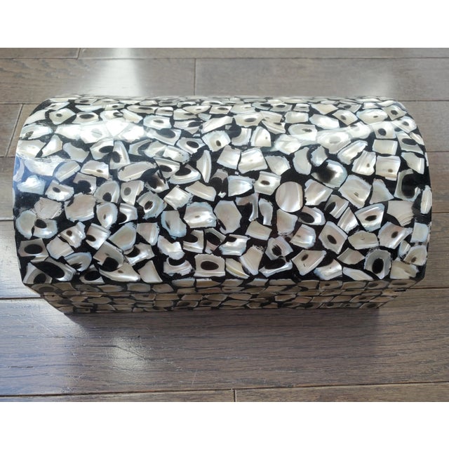 Vintage other of pearl mosaic on a striking ebony background, lacquered to a high shine. The interior is black felt....