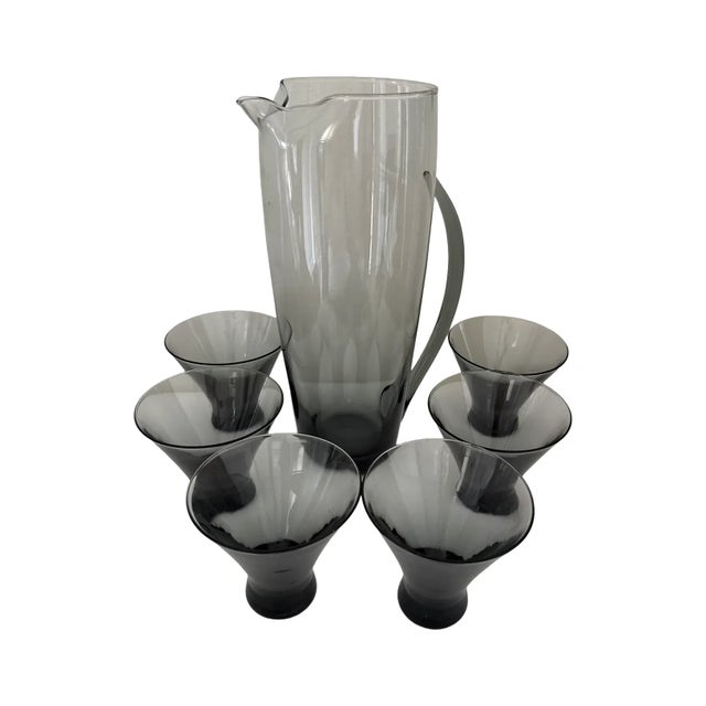 A stunning mid-century modern barware set by Morgantown Glass, featuring the Normandie pattern in elegant smoke gray. The...