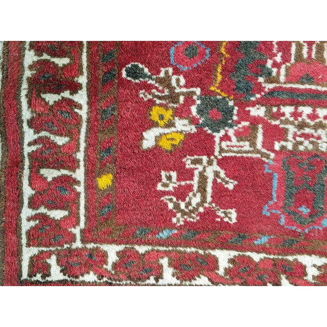 Hand-knotted with care using traditional rug-making techniques, this wool rug blends timeless craftsmanship with a modern...