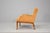 Two elegant lounge chairs, a classic example of T. H. Robsjohn-Gibbings design from the 1950s. The newly padded cushions...