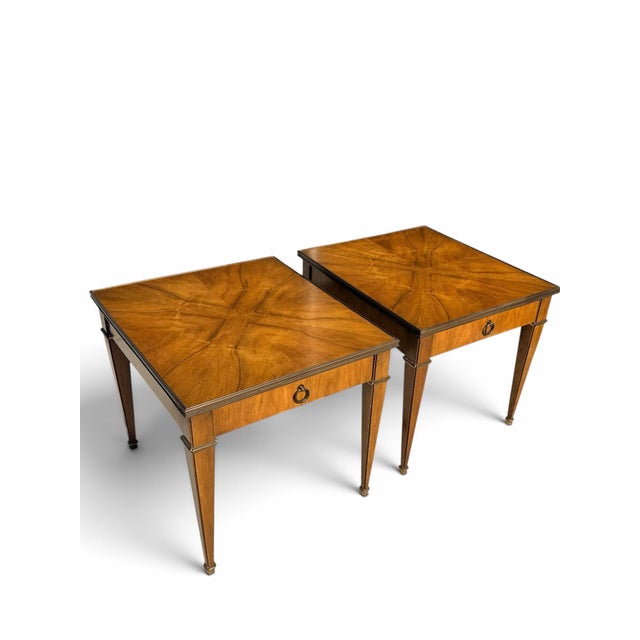 An exceptional matching pair of vintage Baker Furniture satinwood end tables, circa 1970s, featuring beautifully figured...