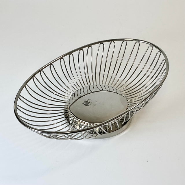 From Wm R Rogers Silver Company, this wire Silverplated Bread Basket Serving Piece is so well designed. It features wire...