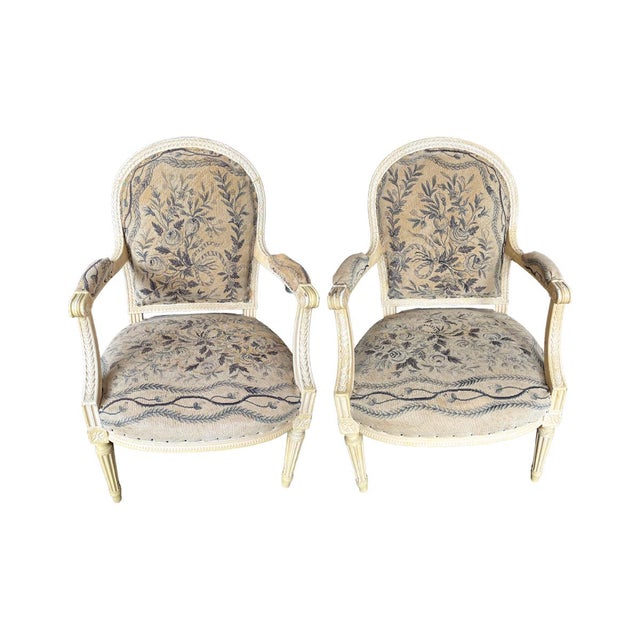 Distressed, off-white finish. Characterized by its medallion-shaped back. Upholstered in a hand-woven 18th Century...