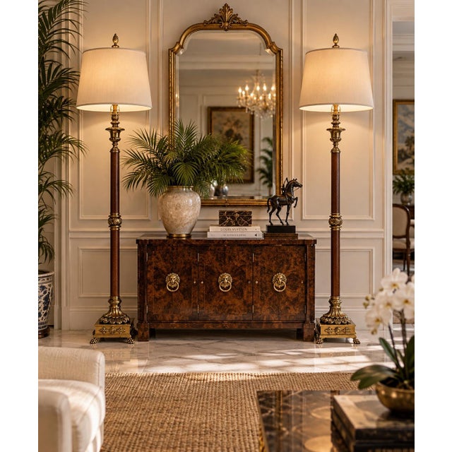 Elegant pair of vintage Neoclassical-style floor lamps featuring tall, slender columns wrapped in rich brown leather and...