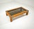 This vintage 1970s coffee table features a beautiful burl veneer frame, embellished with metal corner inserts and a...