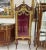 Stunning Red Wine French vitrine. Has been refinished in Italy. Has a beautiful gold details in the door. This piece is in...