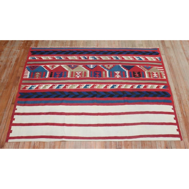A fine example of an early 20th century Persian flat-weave Kilim rug. 5'2'' x 6'11''