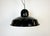 Industrial factory hanging lamp made in Portugal during the 1960s. It features a black enamel shade with white enamel...