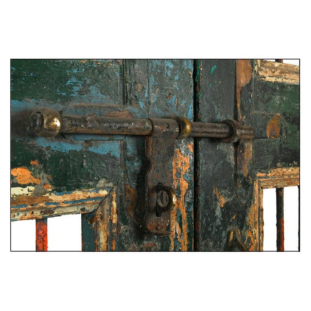 Porte à barreaux en bois patiné This piece is designed in the style of the selected designer and/or manufacturer