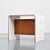 Bedside table designed by Pierre Guariche for apartments in La Plagne and Bandol. Made of U-shaped bent plywood, covered...
