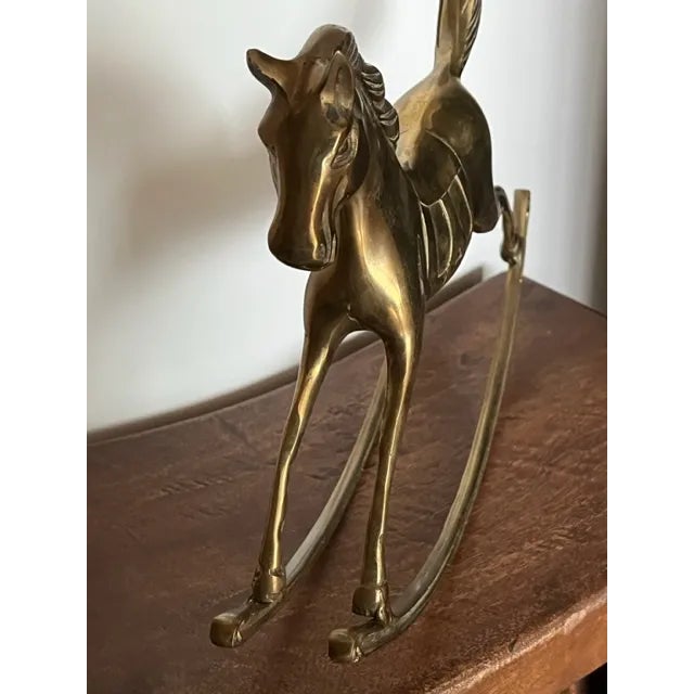 A large vintage brass rocking horse for the burgeoning equestrian - way cheaper than a real pony. Solid brass with...