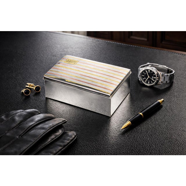 Sleek, sophisticated, and impeccably stylish, this antique Art Deco sterling silver box is a standout piece of refined...