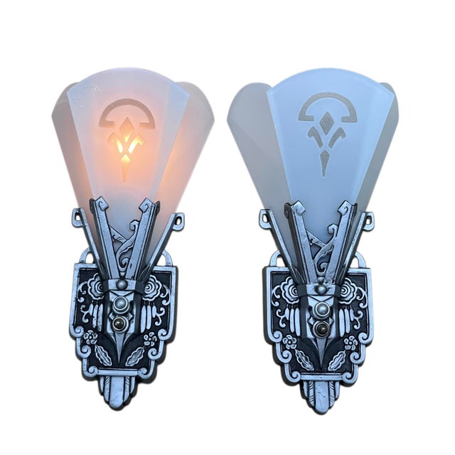 Lovely pair of sconces by Lincoln Manufacturing of Detroit. Flat panels are white flash glass, which is a thin layer of...