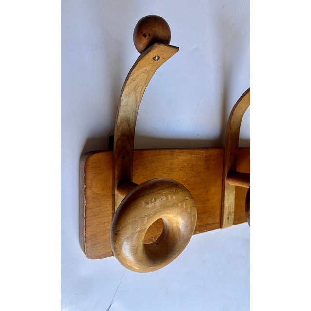 Unique mid-century modern coat and hat rack. Imported from France. Contemporary bentwood design with balanced sputnik type...