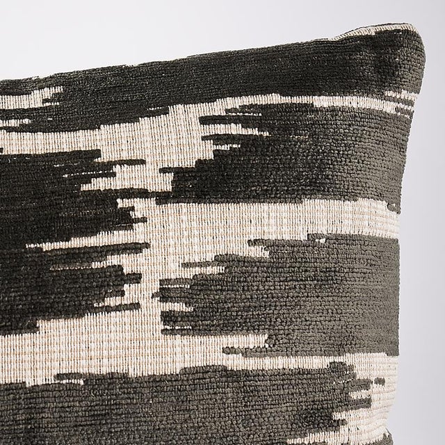 This pillow features Gibson with a knife edge finish. Super soft chenille yarns form an irregular, abstracted pattern on a...