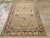 This mid-20th-century Persian Malayer accent rug presents a balanced floral and geometric composition across a soft blue-...