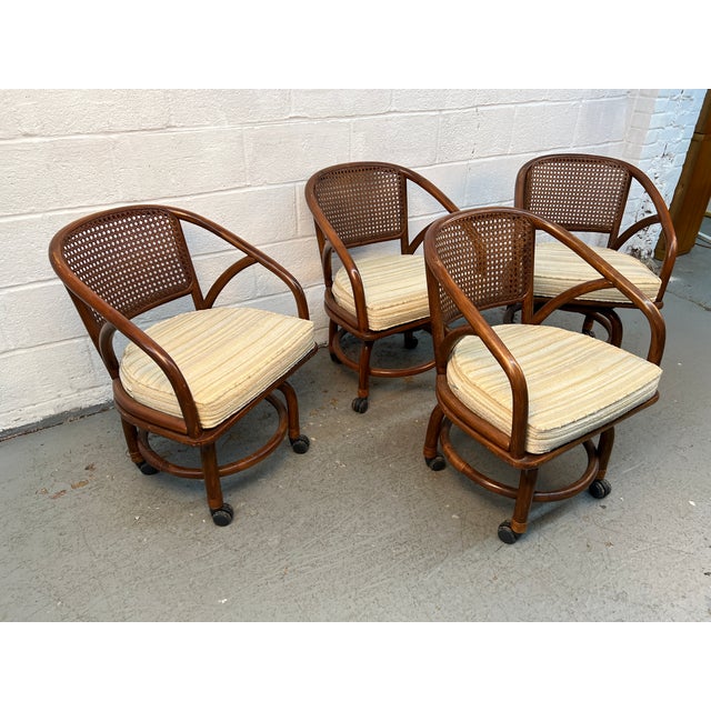 Bring classic vintage charm to your dining space with this beautiful set of four wicker and rattan dining chairs by Clark...