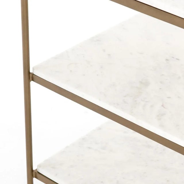 Add a pop of sophistication to any space. Classic white marble lays three tiers of smooth shelving for plenty of space,...