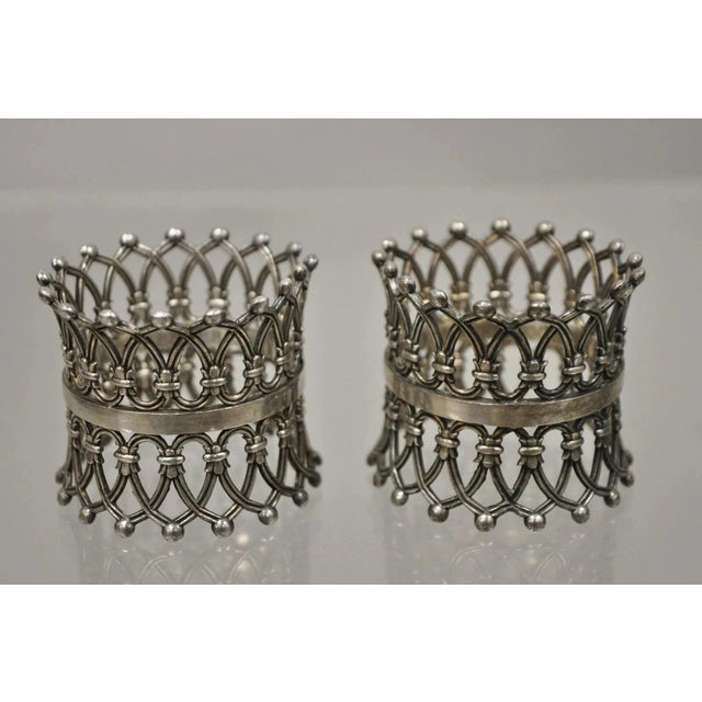 Antique English Victorian Silver Plated Fretwork Crown Napkin Rings - a Pair. Item features ornate pierced fretwork...