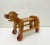 A cute vintage dog on wheels from the 1950s-1960s. This toy dog has a seat for a child and can be used as a toy car. The...