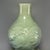 Fine antique Chinese celadon double‑gourd vase. Classic double gourd silhouette adorned with raised floral relief carving,...