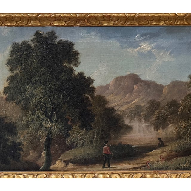 A small oil landscape with a wooded, hilly scene and a misty river or stream in the middle distance. A figure is visible...