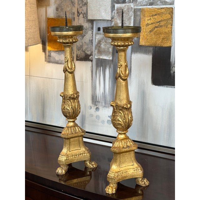 Design Plus Gallery presents a Pair of Gilt Candle Prickets. These are likely from the 19th century and have a...