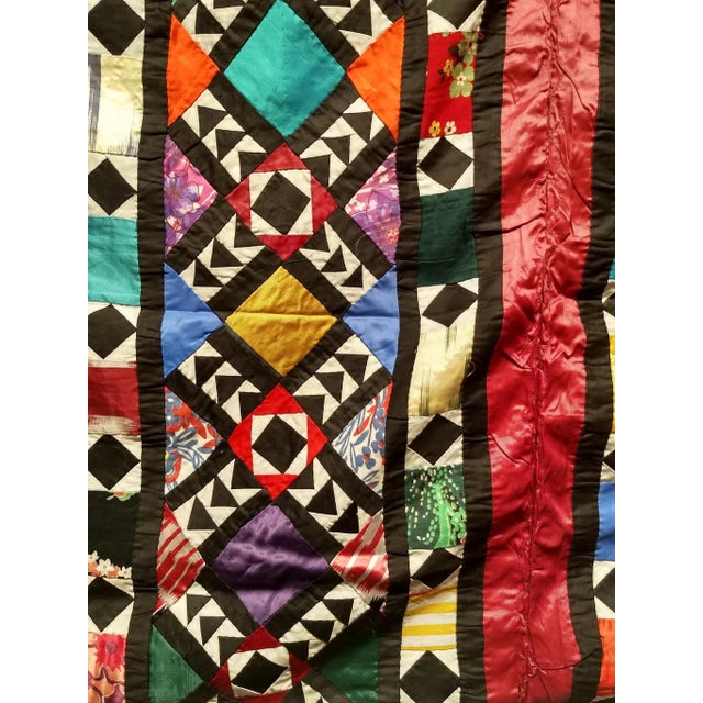 Beautiful vintage hand-stitched “pieced” silk quilt from Uzbekistan in Central Asia from the mid 1900s. The silk fabric...