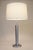 A brilliant and stunning monumental Mid Century Modern brush Stainless Steel table lamp designed and manufactured by...