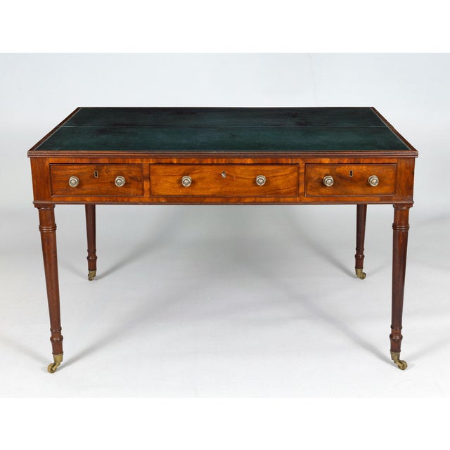 Most unusual, unique and rare 19th Century mahogany writing table, half the top is hinged and opens to reveal seven...