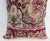 Decorative pillow upholstered in a 19th century Kerman rug fragment, featuring charming floral flowerhead motifs and an...