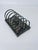 Solid vintage metallic letter holder. Base is set upon four feet with perforated holes along sides.