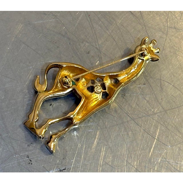1970s-80s gold-tone/black/rhinestone giraffe brooch. Excellent condition.